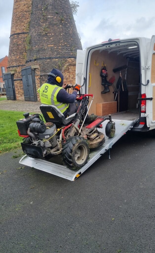 mower being loaded into van using heavyweight van ramp