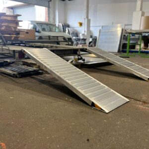 Lightweight trailer ramps loading on to trailer