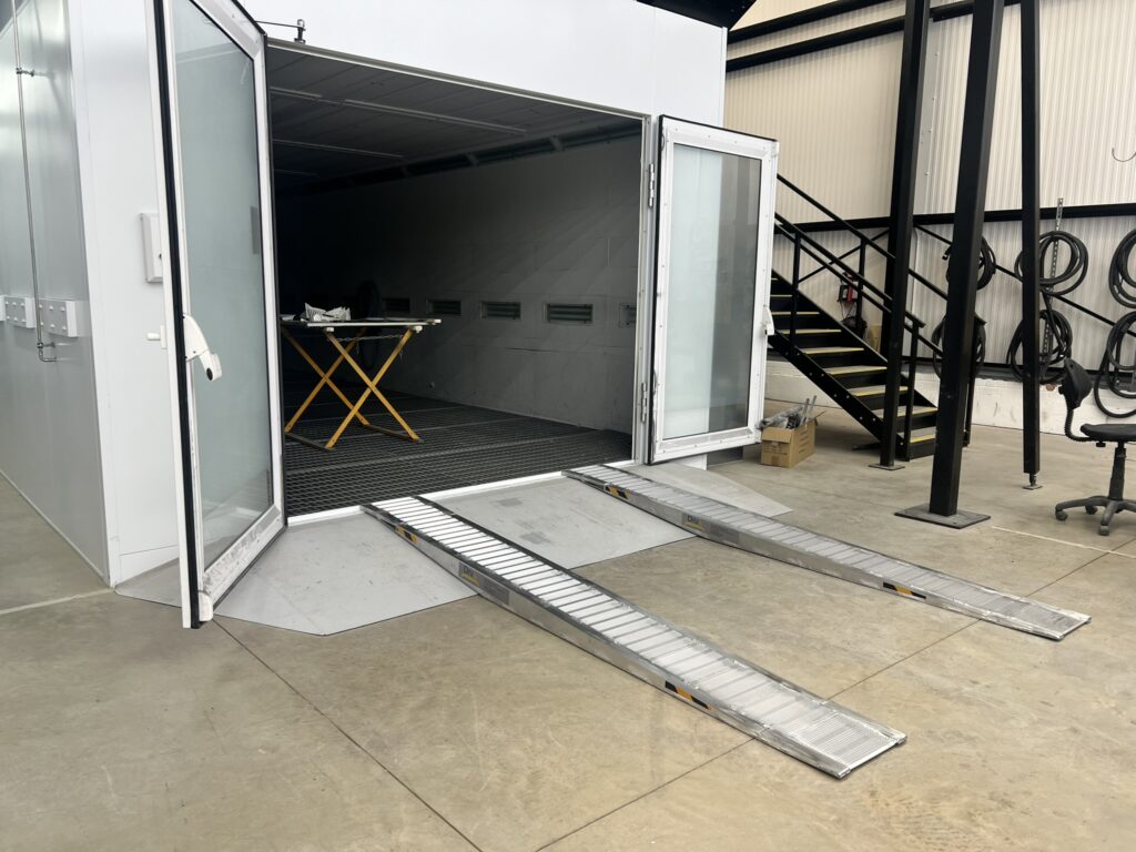 Heavy-duty metal vehicle ramp providing safe loading access for commercial transport.