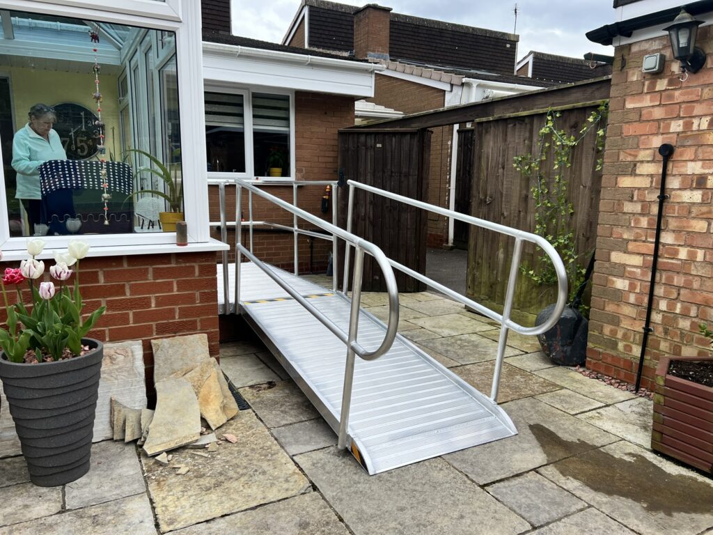 Sturdy metal wheelchair access ramp ensuring reliable and safe entry.