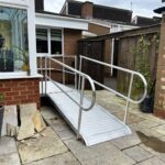 Sturdy metal wheelchair access ramp ensuring reliable and safe entry.